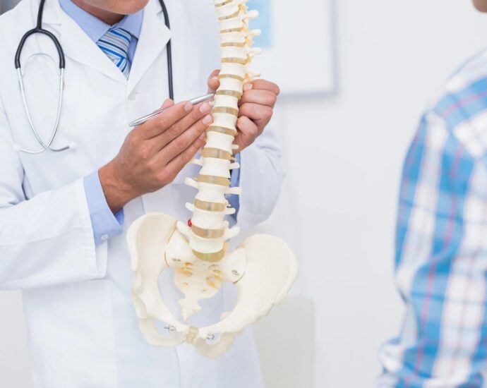 doctor showing spine
